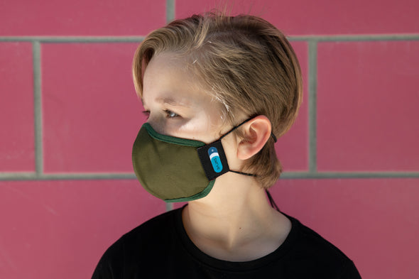 model wearing abby's kids summer cotton mask in wonder wood