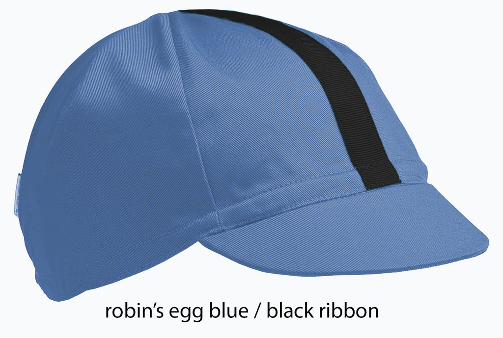 flat shot of the robin's egg blue 4 panel cap with black ribbon