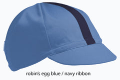 flat shot of the robin's egg blue 4 panel cap with navy ribbon