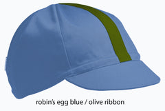 flat shot of the robin's egg blue 4 panel cap with olive ribbon