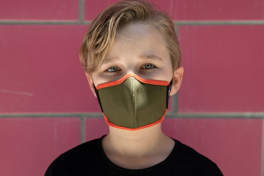 model wearing abby's kids summer cotton mask in peach