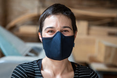 Roxy is wearing the mid-summer cotton mask in navy