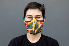 Roxy wearing the African cotton mask in mango chili in the adult fit