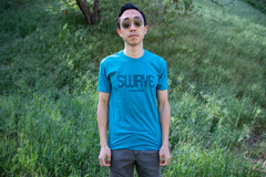 Teddy in a classic cotton/poly 1968 swrve logo t-shirt in cyan.