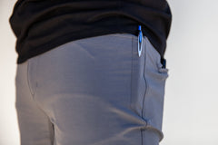pen pocket detail of the TRANSVERSE trouser short in grey