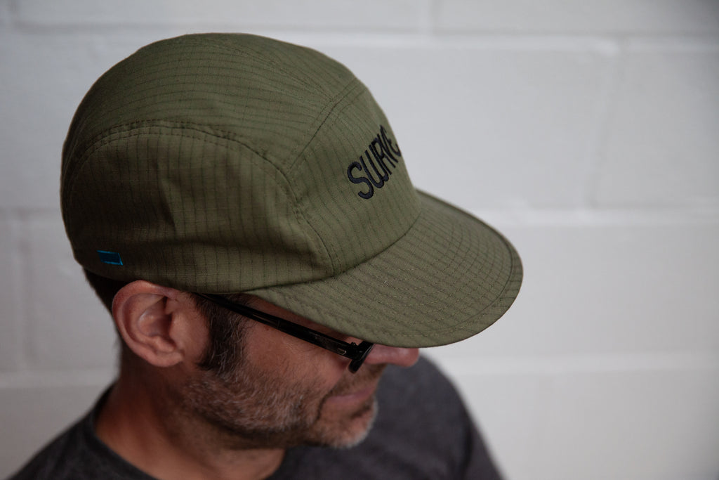 Matt in profile wearing the swrve 1968 logo embroidered CORDURA combat wool camp hat in green
