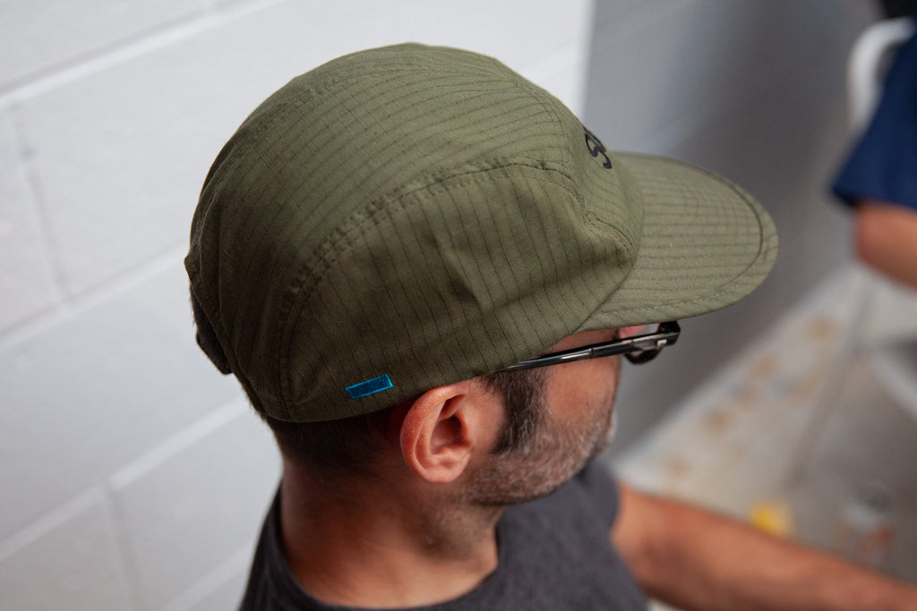 Side panel of the swrve 1968 logo embroidered CORDURA combat wool camp hat in green