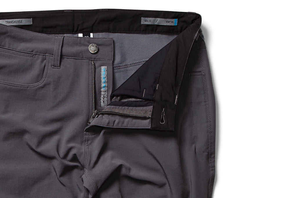 flat shot zipper detail of the TRANSVERSE slim trousers in grey