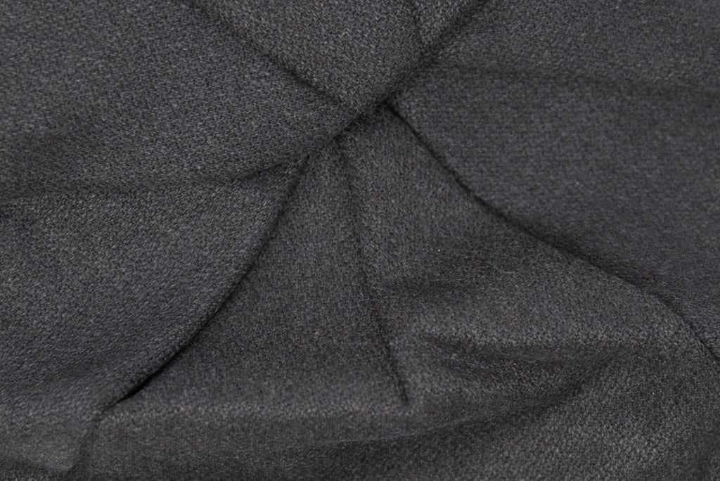 detail of the black heavy-weight wool fabric