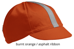 flat shot of the 4-panel cotton cap in burnt orange with an asphalt ribbon