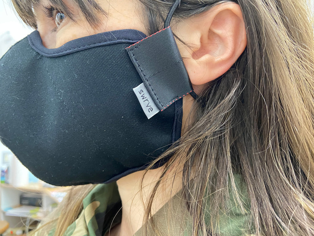 side view of the 4 layer cotton mask in black on roxy